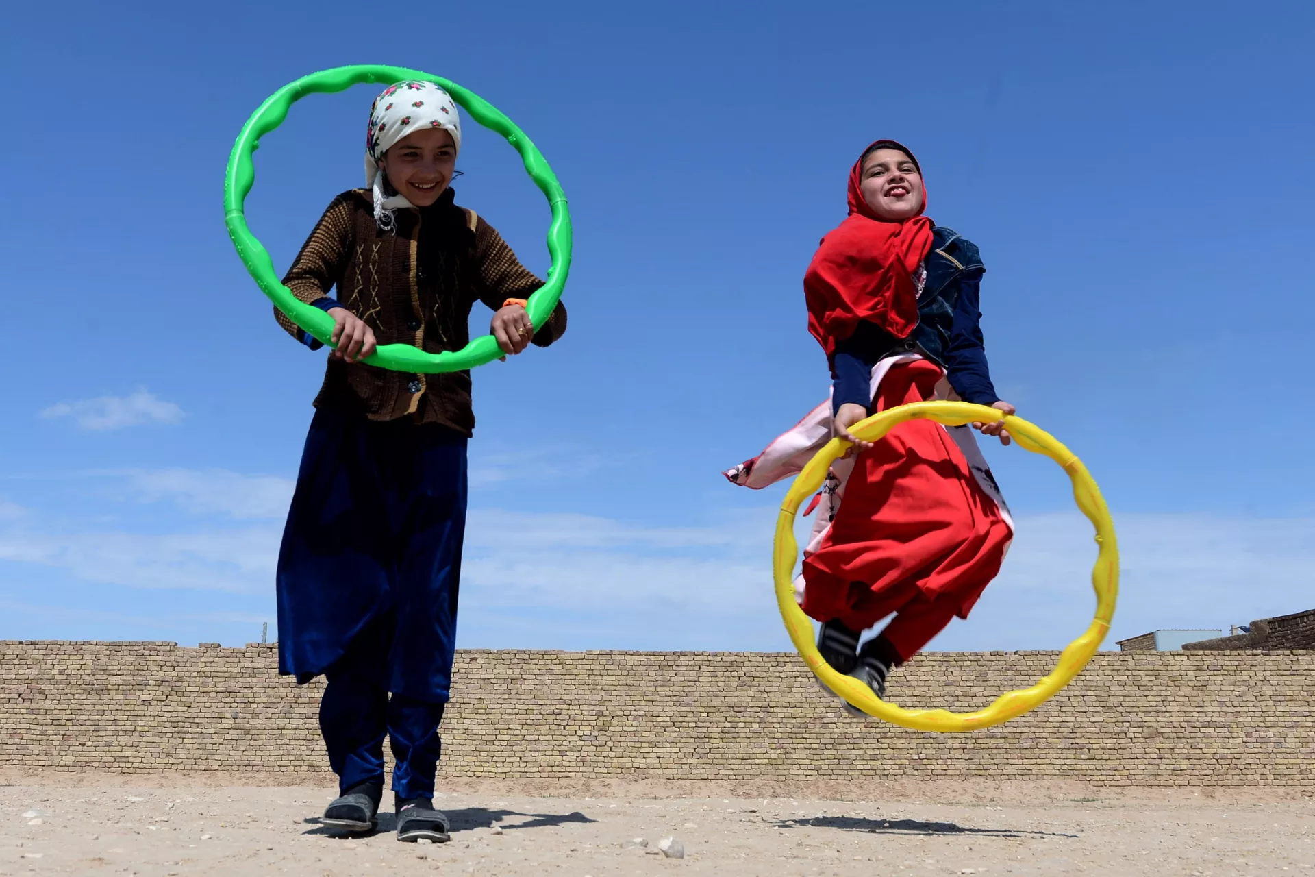 Afghanistan. Two girls play at a child friendly space in northern Afghanistan.