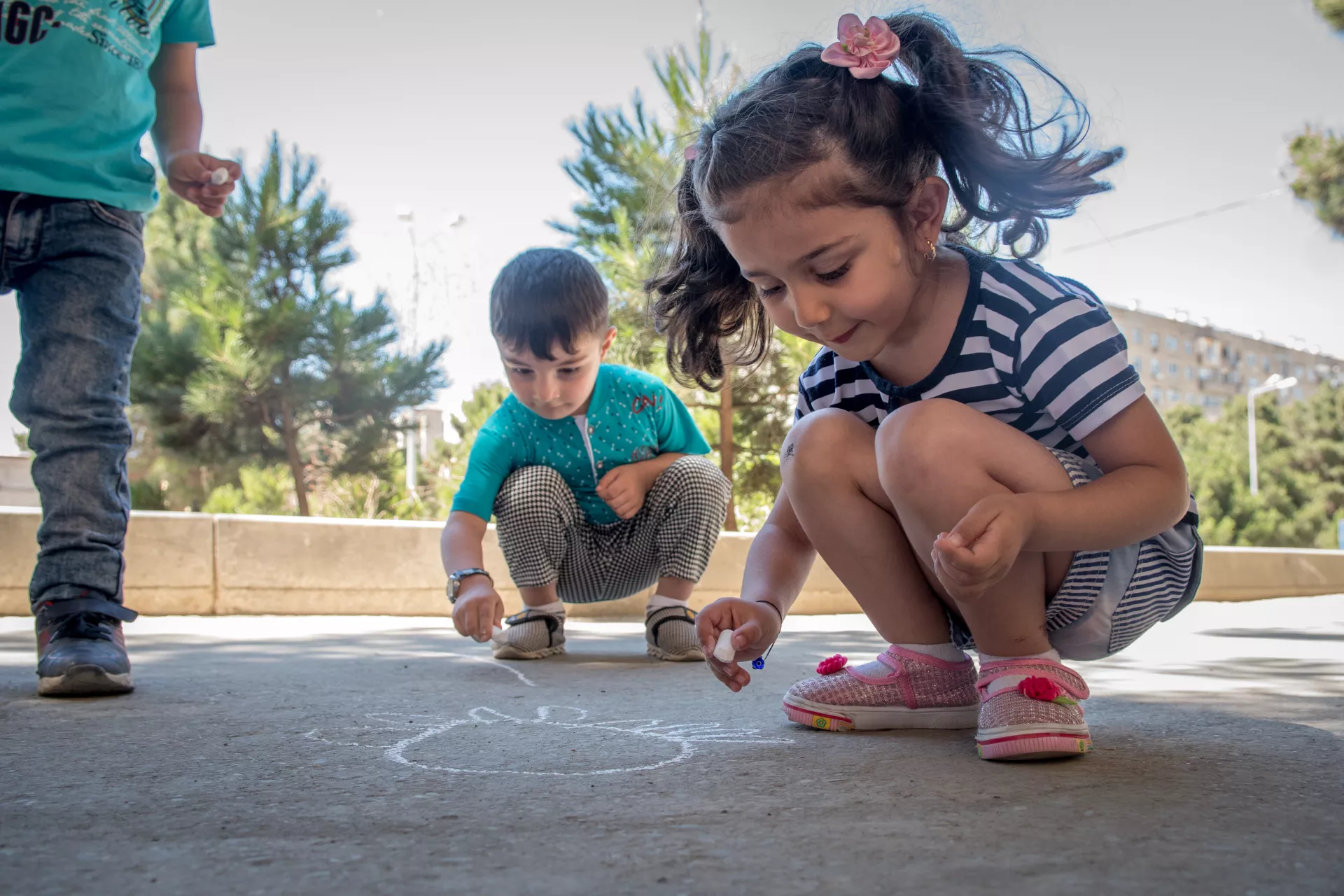 Children playing with chalk at the Early Learning Centre
