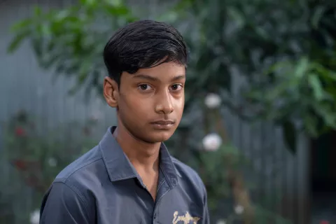 Mohin Shikder, a ninth-grader from Bangladesh, gazes directly at the camera.