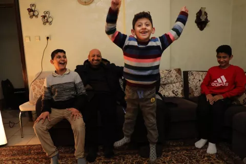 (From left to the right) Eyniyad, Cihad, and Gaffur watching Muhtemen showing how he jumps while counting the numbers in Turkish at their house in Şanlıurfa, Turkey.