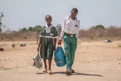 Two children walk home from school