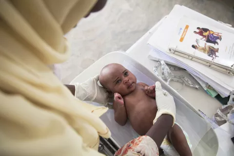 A baby is being weighed at a UNICEF-supported health centre in Borno State.
