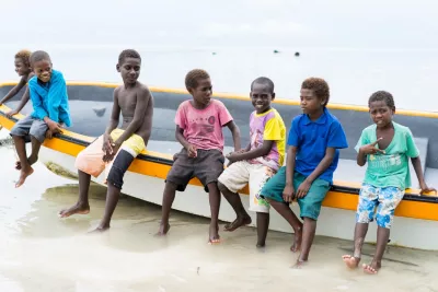 Children sitting on a boat.