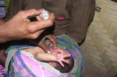 Four-day-old baby Gaoma receives her first oral polio drop during the Supplementary Immunisation Activity at Gautokomena Village in inland Rigo District of Central Province.
