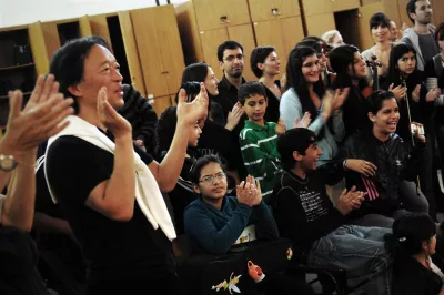 UNICEF Goodwill Ambassador Myung-Whun Chung claps with children during a performance in Buenos Aires, Argentina, in 2010.