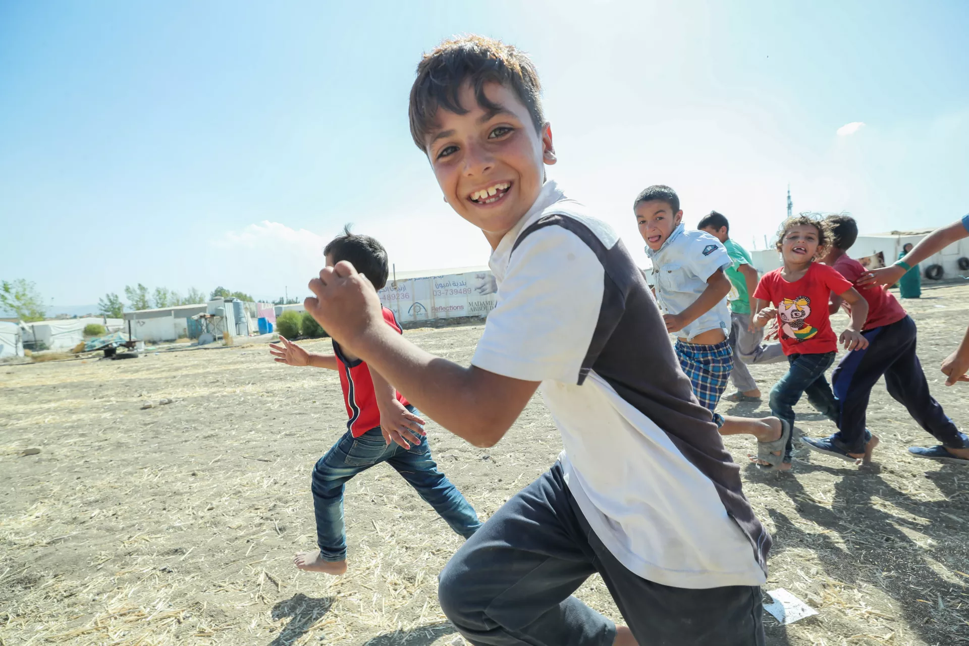 Convention on the Rights of the Child: A group of Syrian refugee children play together in an informal settlement in Lebanon.