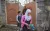 Isra’s mother says goodbye as she and her sister leave their home to walk to school