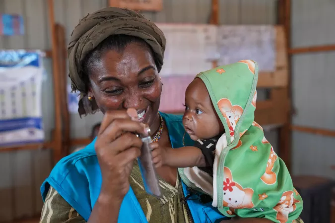On 24 May 2022, Rania Dagash, UNICEF Deputy Regional Director for Eastern and Southern Africa, holds 9-month-old Farah at the Health and Nutrition Center in Dollow, Somalia.