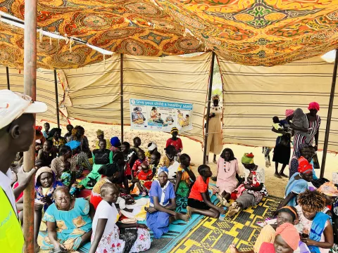 Mothers being screened before receiving cash in Aweil East 