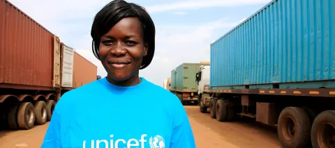 Victoria Kiko, a senior warehouse assistant for UNICEF in South Sudan, stands in the town of Kiech Kon in Upper Nile State – where UNICEF and partner organisations have deployed a rapid response team to assist displaced people in remote and hard-to-reach areas affected by the conflict, in August 2014.
