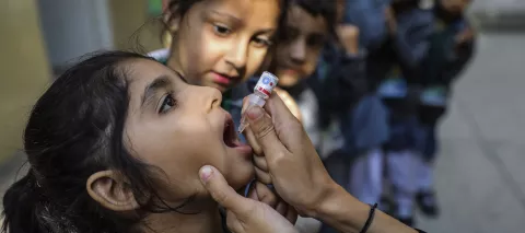 Four-year old Fizza receives the oral vaccine against polio at DHA Collage School System, Neelum Campus during Polio D National Immunisation Day (NID) in Karachi Sindh Province, Pakistan, 2019.