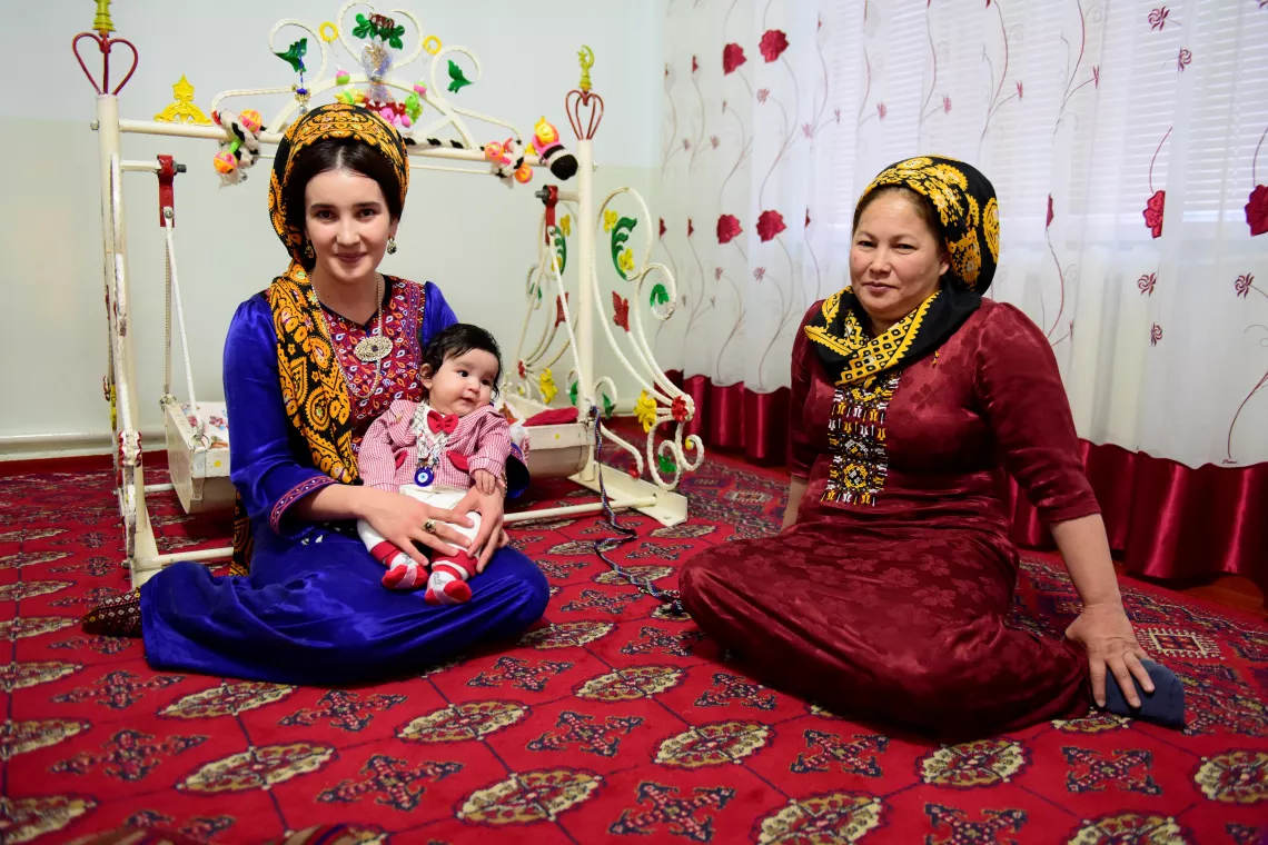 Turkmen family with a baby, mother and grandmother