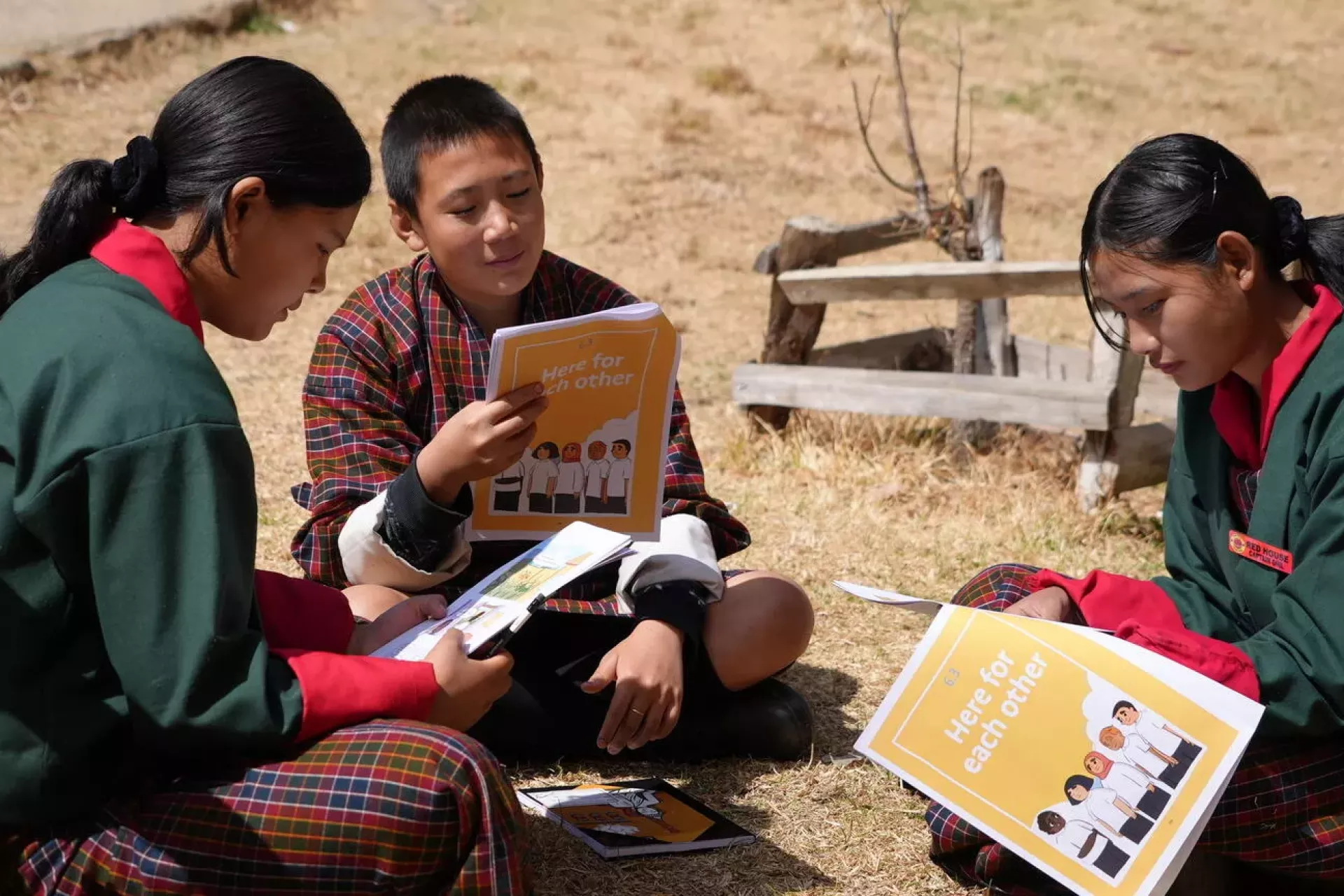Grade 7 students read the Magnificent Mei comic, during the Helping Adolescent Thrive (HAT) consultation at Genekha Primary School, Thimphu, Bhutan