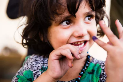 An Afghan girl shows the purple ink mark on her finger, indicating she has been vaccinated against polio during an immunization campaign in Jalalabad, eastern Afghanistan. 
