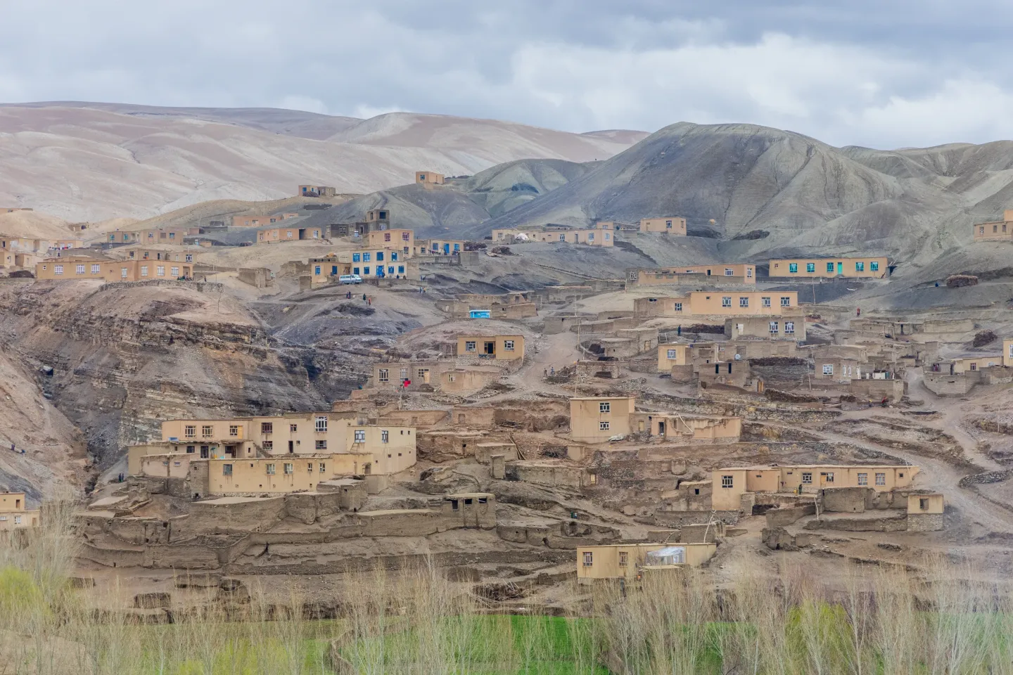 A landscape view showing the water storage tank located on top of a mountain, supplying water to homes across the community. Tagab Ghalmin, Ghor Province, Afghanistan