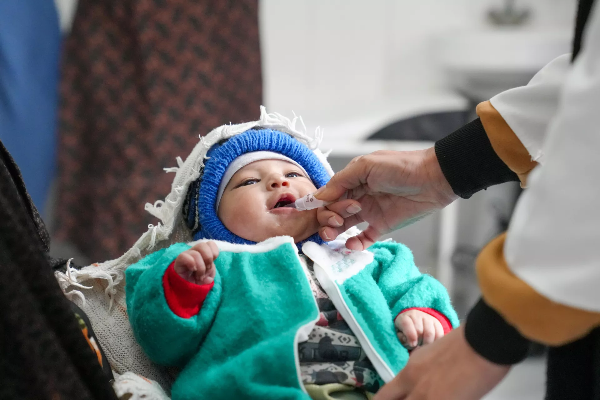 A baby boy in Herat, Afghanistan is vaccinated at Babaye Barq Clinic with support from UNICEF.