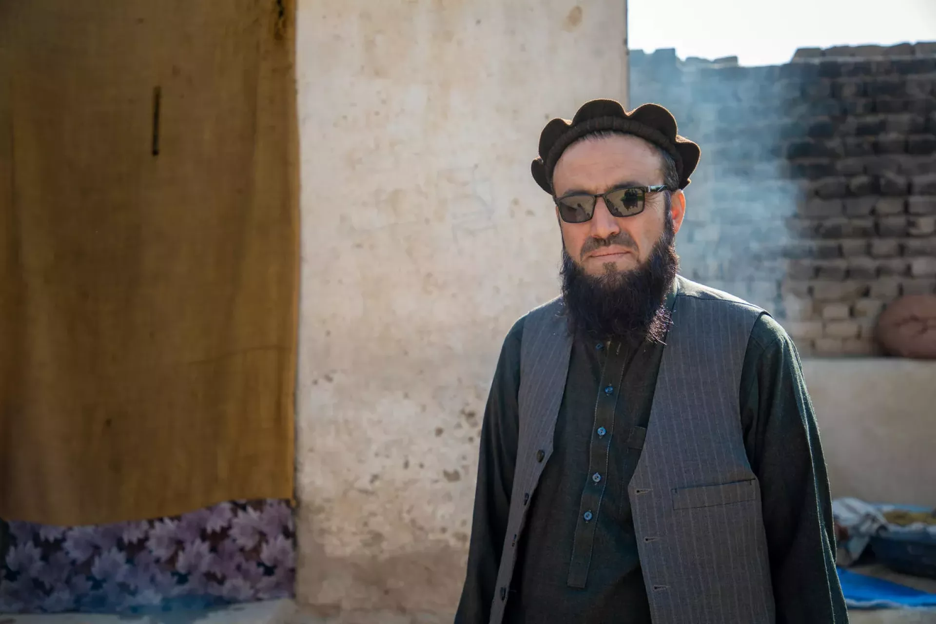 On 17 November 2024, Qari Rahmatullah, head of community council or 'shura' in charge of CLTS, is photographed at his home in Sheikh Mesri village, Sorkhrod district, Nangarhar province, Afghanistan.