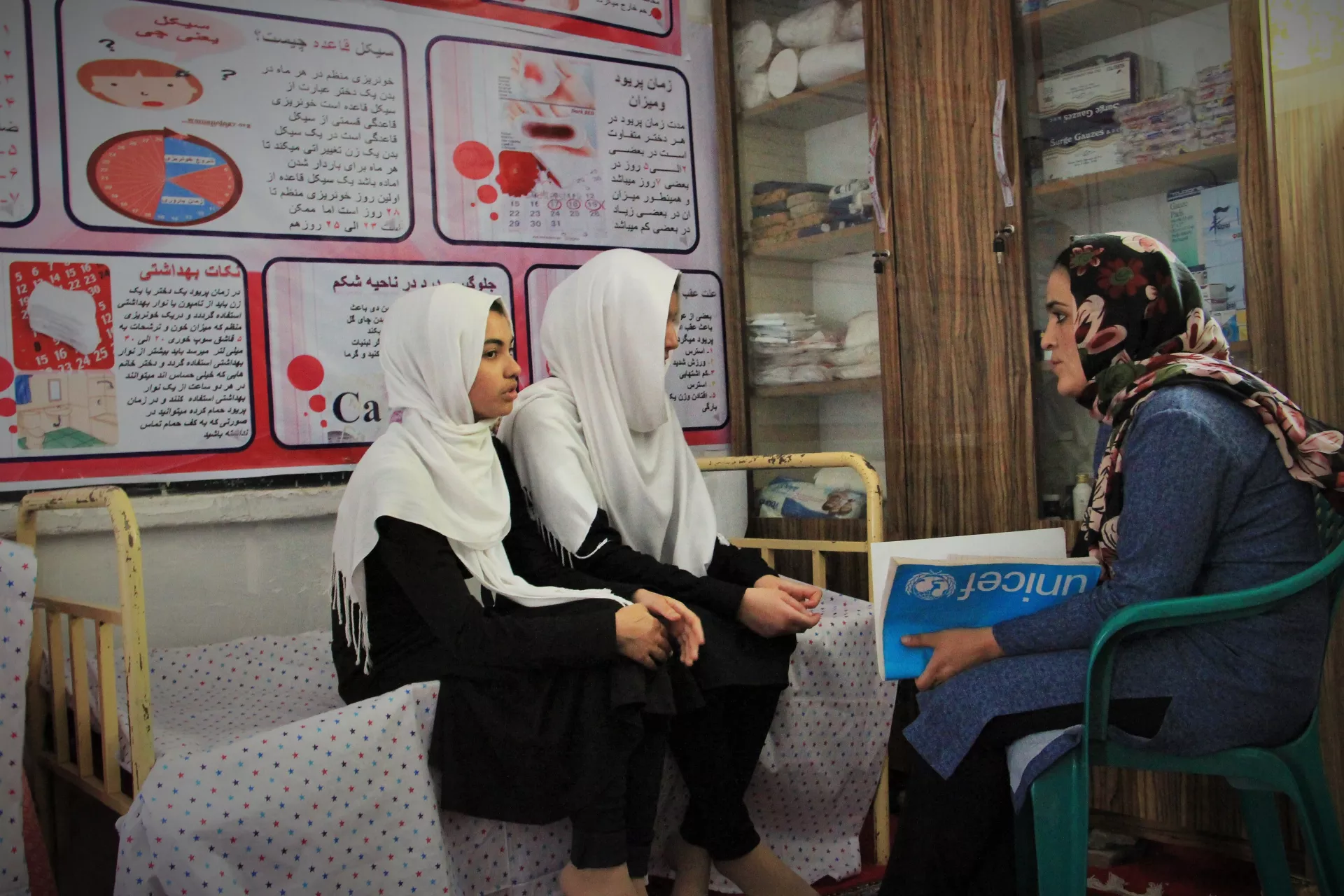 Two students attend a menstrual hygiene management counselling session at a school in Herat, Afghanistan. 
