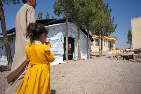 On 11th October 2023, the UNICEF-supported health clinic, established as part of the earthquake response, in Karnil Wardaka village, Zinda Jan District, Herat Province, western Afghanistan. The original health centre was badly damaged in the earthquake and can be seen in the background.