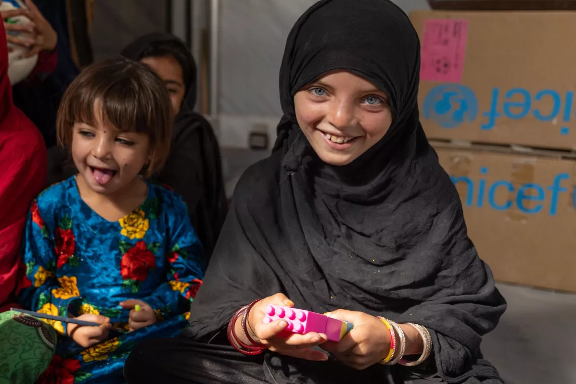 On 17 June 2023, Naghma smiles inside a UNICEF supported child friendly space in Paktika Province, Gayan District, Afghanistan, which was established in her community following the earthquake in 2022.