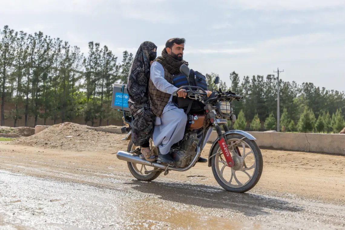 Omid and Nadia, the vaccinator couple travels a long and challenging roads by motorbike to reach the underserved communities and administer vaccines to children and women. 
