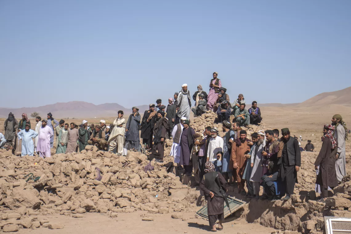 On 9 October 2023, crowds gather for search and rescue efforts in Zinda Jan district, Herat Province, Afghanistan, where the earthquake destroyed many homes two days prior.