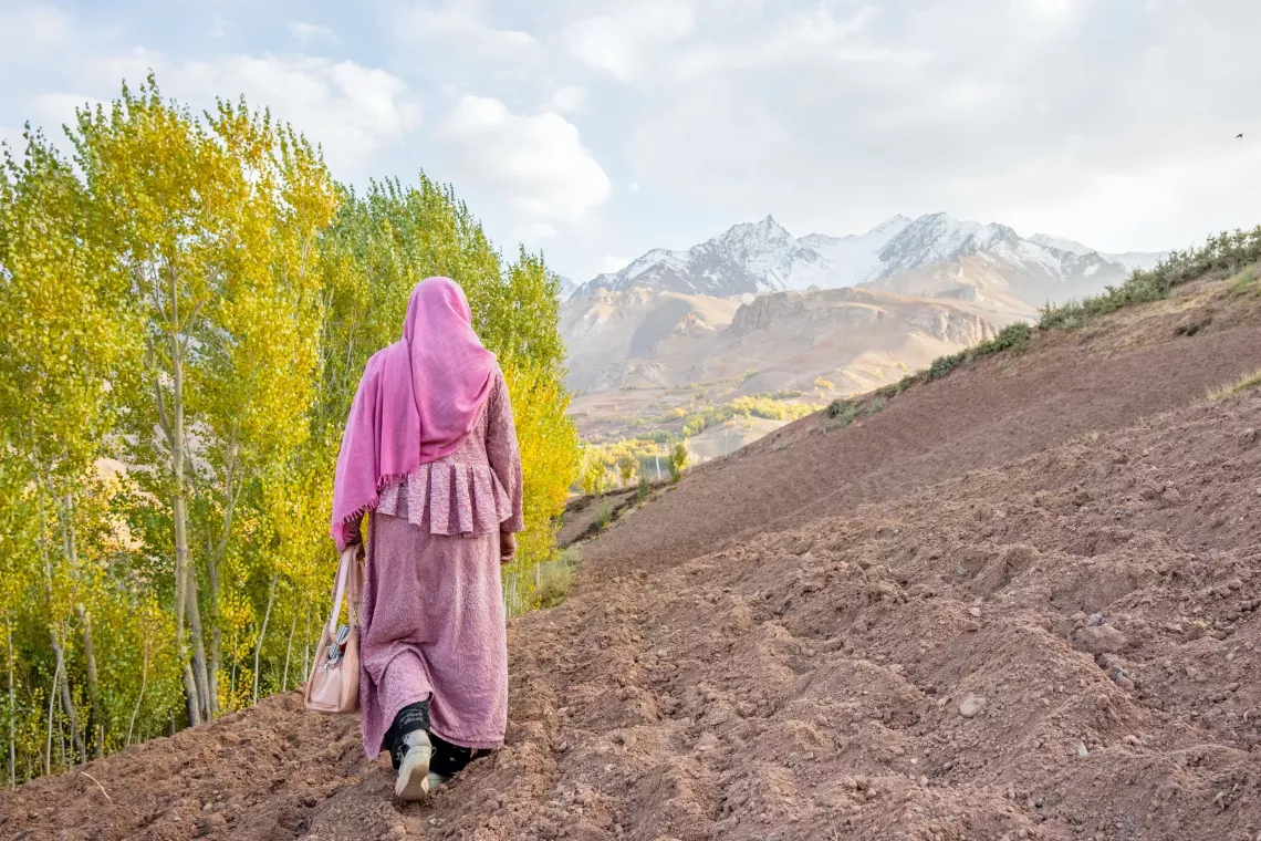 On the 21st October 2024, Sakina, a UNICEF-supported community health worker, walks to a neighbouring community in Bamiyan Province, central Afghanistan.