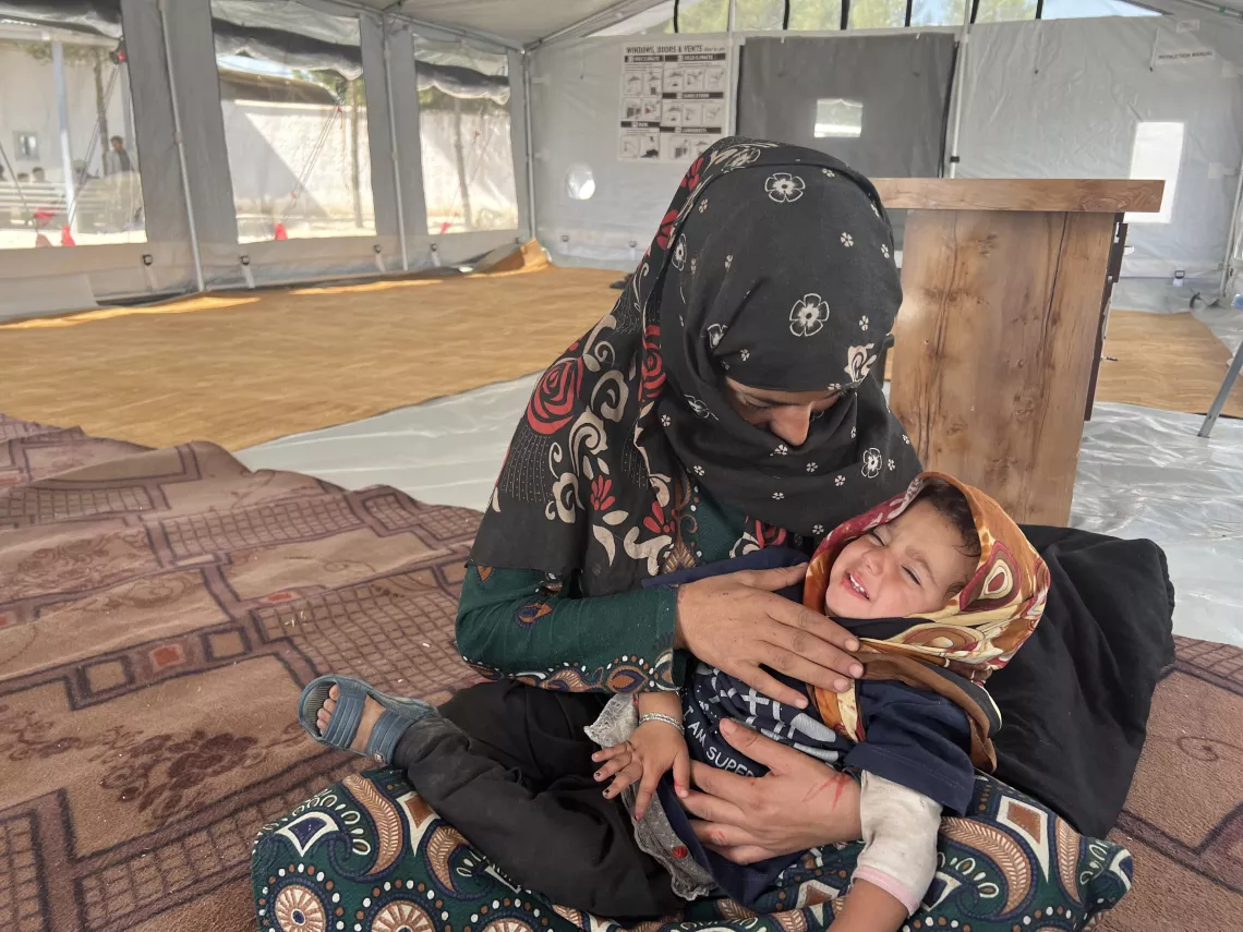 On 10 October 2023, 21-year-old Asifa cares for her daughter, Asra, at a UNICEF supported transit center in Herat city where she moved after the earthquake in Afghanistan destroyed her home and she lost a child.