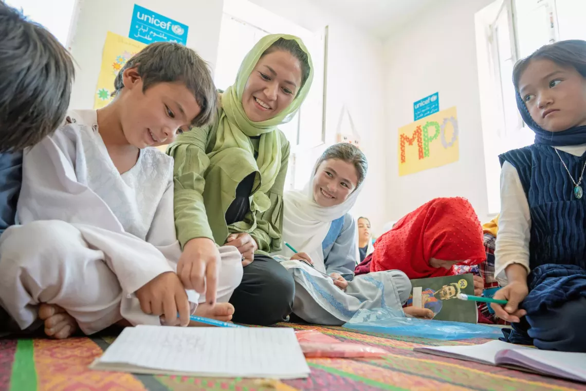 On 1st October 2022, 20 year old Rubaba teaches children at the UNICEF-supported and EU-funded Child Friendly Space (CFS) in Nili District, Daikundi Province in central Afghanistan. 