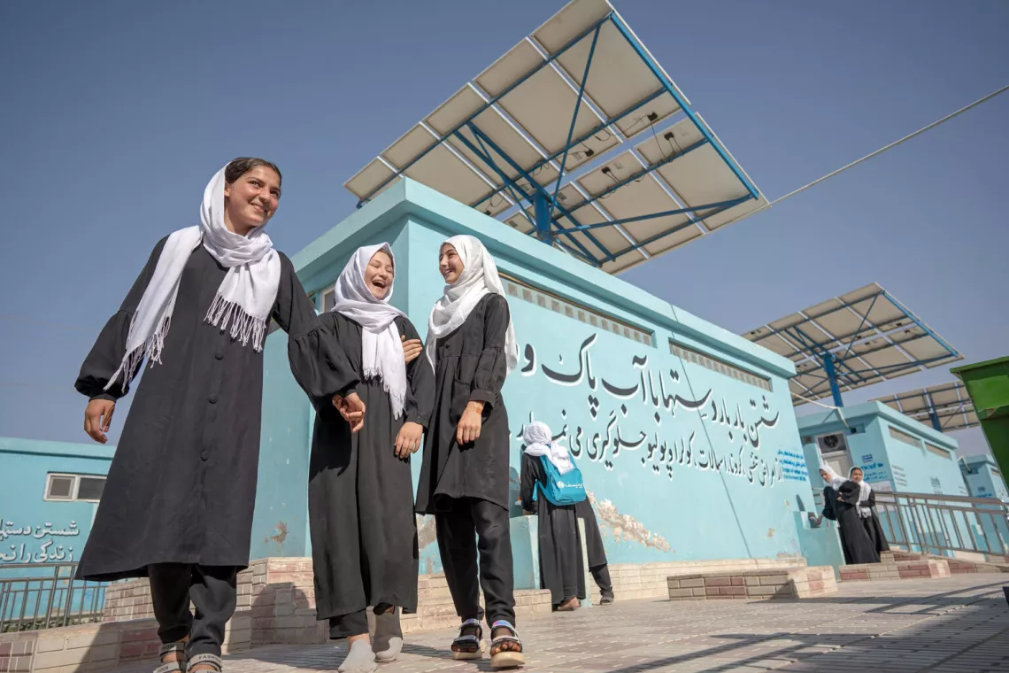 On 15th June 2023, 11 year old Madina (third from left) outside the latrines at the Mawlana Jalaluddin Mohammad Balkhi School in Mazar-i-Sharīf, Balkh Province, Afghanistan.