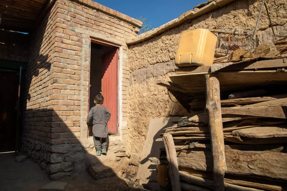 On 17 November 2024, Emal, 5, uses the latrine at his family's home in Sheikh Mesri village, Sorkhrod district, Nangarhar province, Afghanistan.