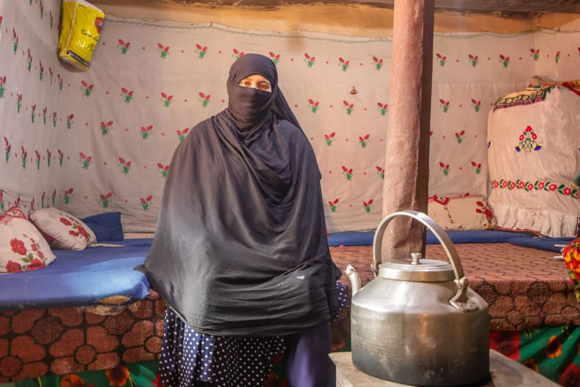 On 28 November 2023 in Parun district, Nuristan province, Afghanistan, In her one-room home she shares with seven children and her husband, Saeed Khanum reflects on how she plans to spend her cash assistance from UNICEF to support her girls' education.