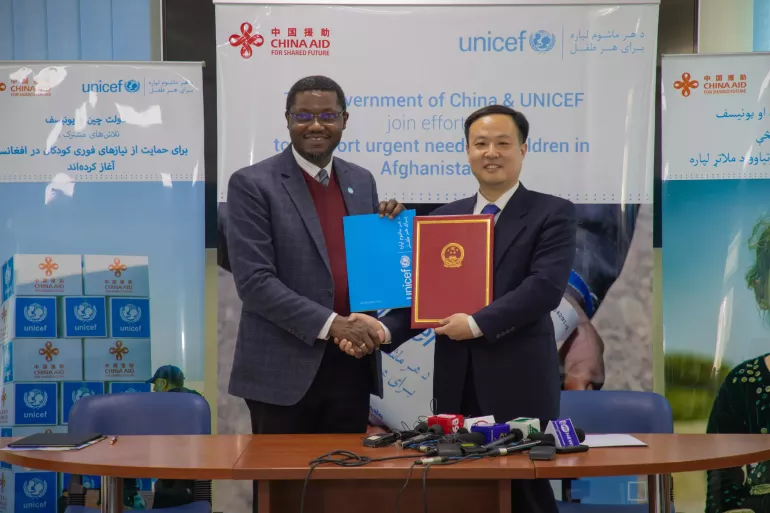 On 28 November 2024, Tajudeen Oyewale, UNICEF Representative in Afghanistan (left) and Ma Chenguang, Counselor of the Embassy of China (right), forge a historic first-time partnership between China and UNICEF in Afghanistan under China's recent $1.5 million contribution for WASH supplies.