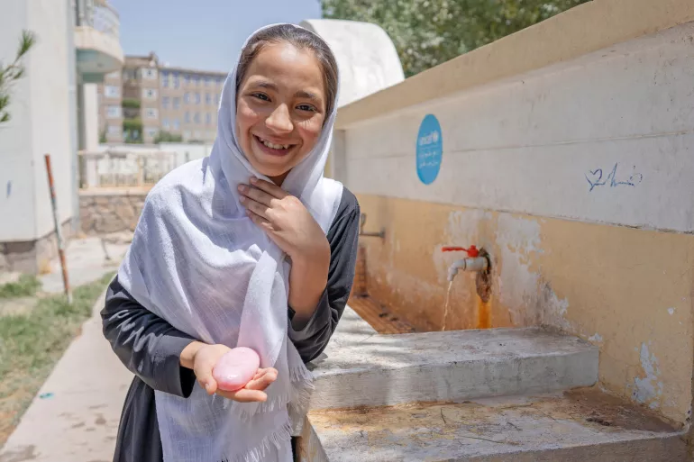 On 13th June 2022, eleven year old Sadaf Samadi holds a bar of soap at the UNICEF-supported Fatah Girls School in Herat, Afghanistan.