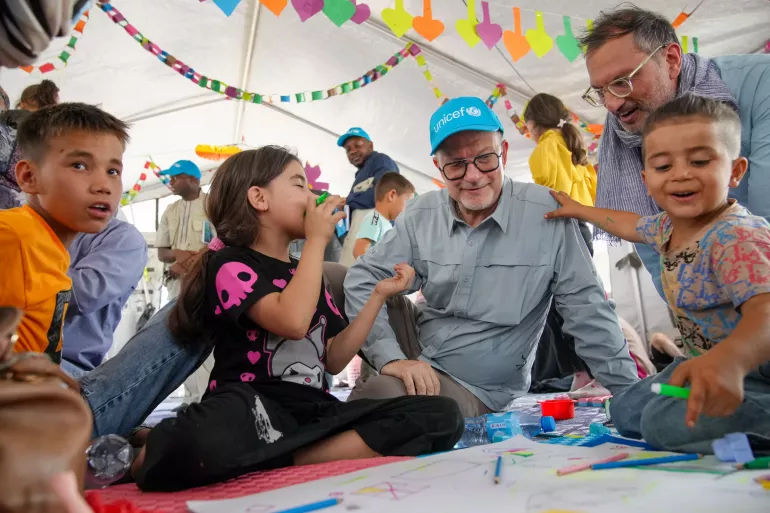 On 5 August, UNICEF Deputy Executive Director for Humanitarian Action and Supply Operations, Ted Chaiban, sits with children in a Child Friendly Space set up by UNICEF in the border reception center at Islam Qala in Western Afghanistan near Herat.&nbsp; Background: The Islam Qala Reception Center (RC) is a key facility located at the Afghanistan-Iran border, serving as one of the primary entry and exit points for refugees, asylum-seekers and returning Afghan nationals. The RC operates within a multi-agency frame