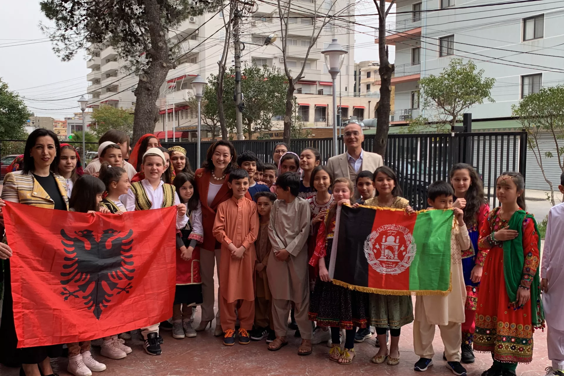 Afghan & Albanian children group photo with their flags