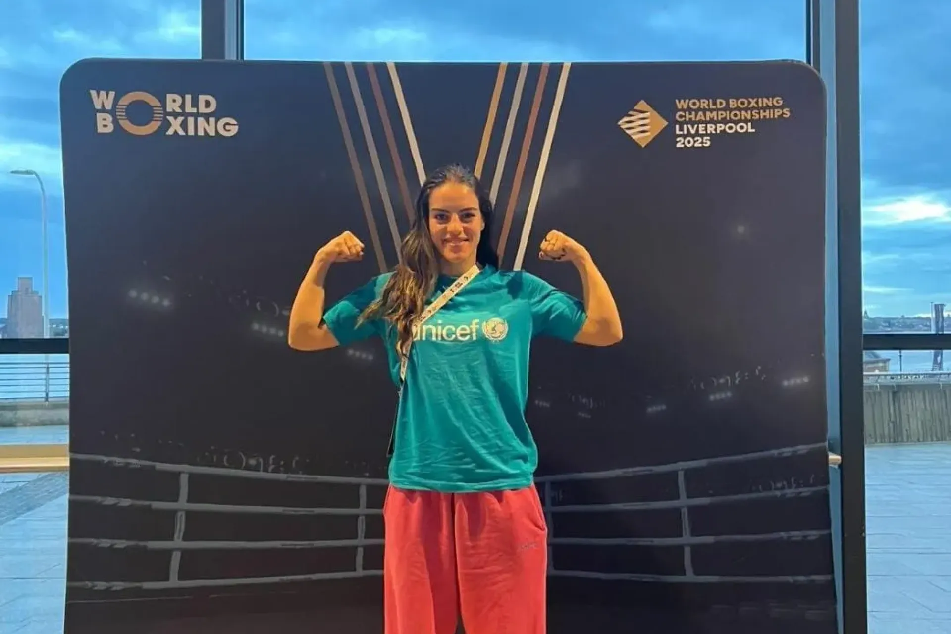 Boxer Esmeralda Novruzaj standing on podium