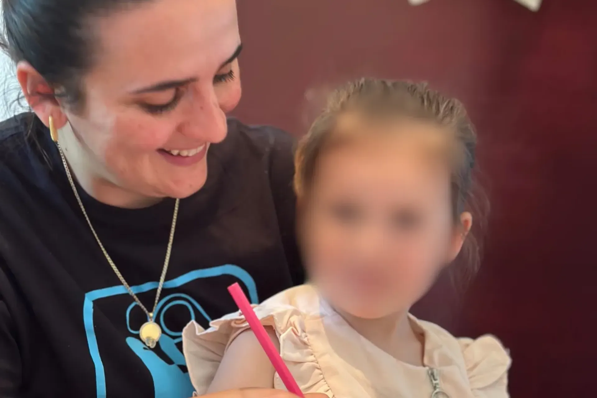 woman with child smiling