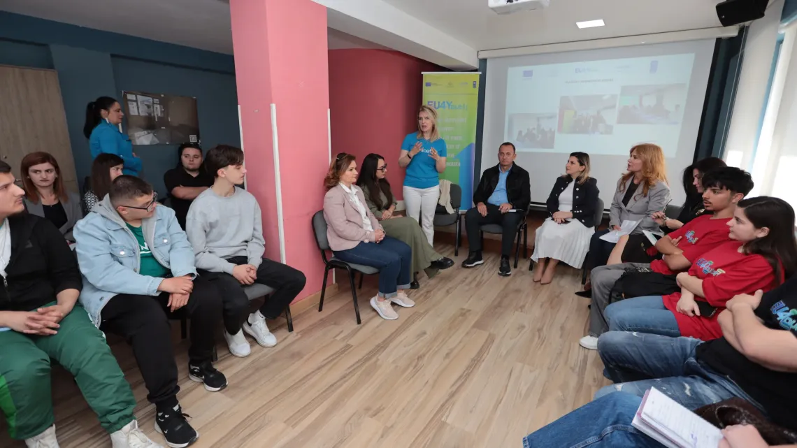 UNICEF staff meeting with a youth group