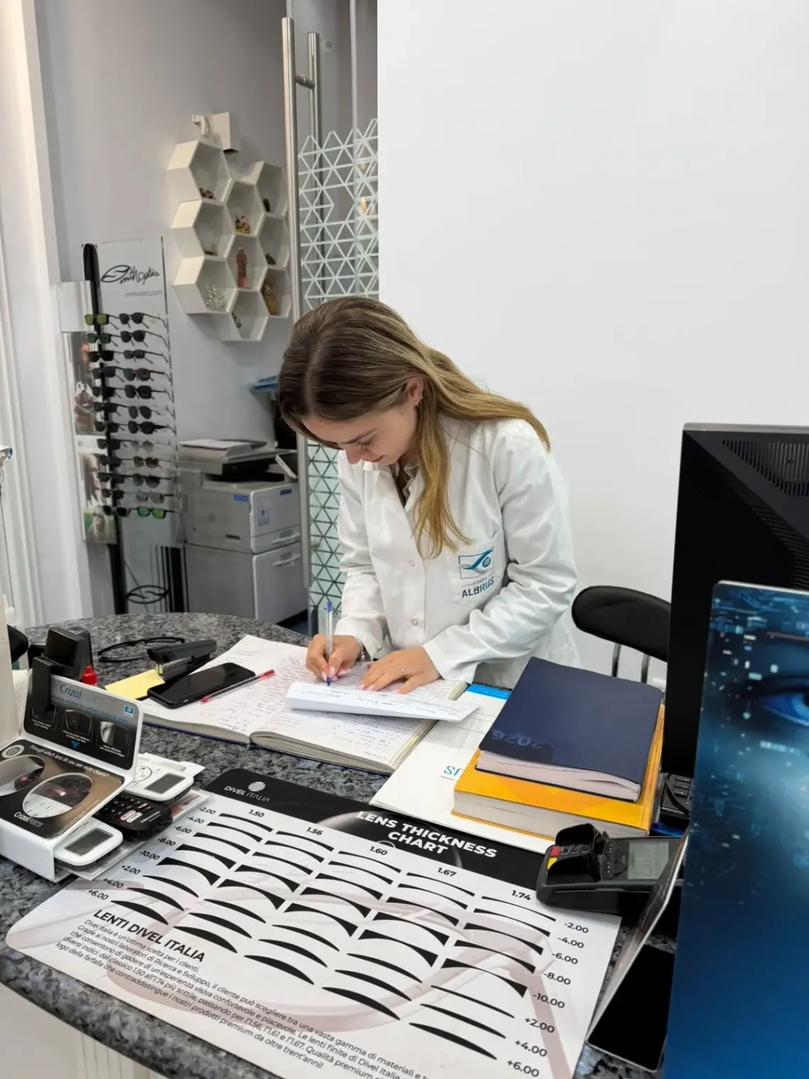 nurse working in her office writing something on the paper