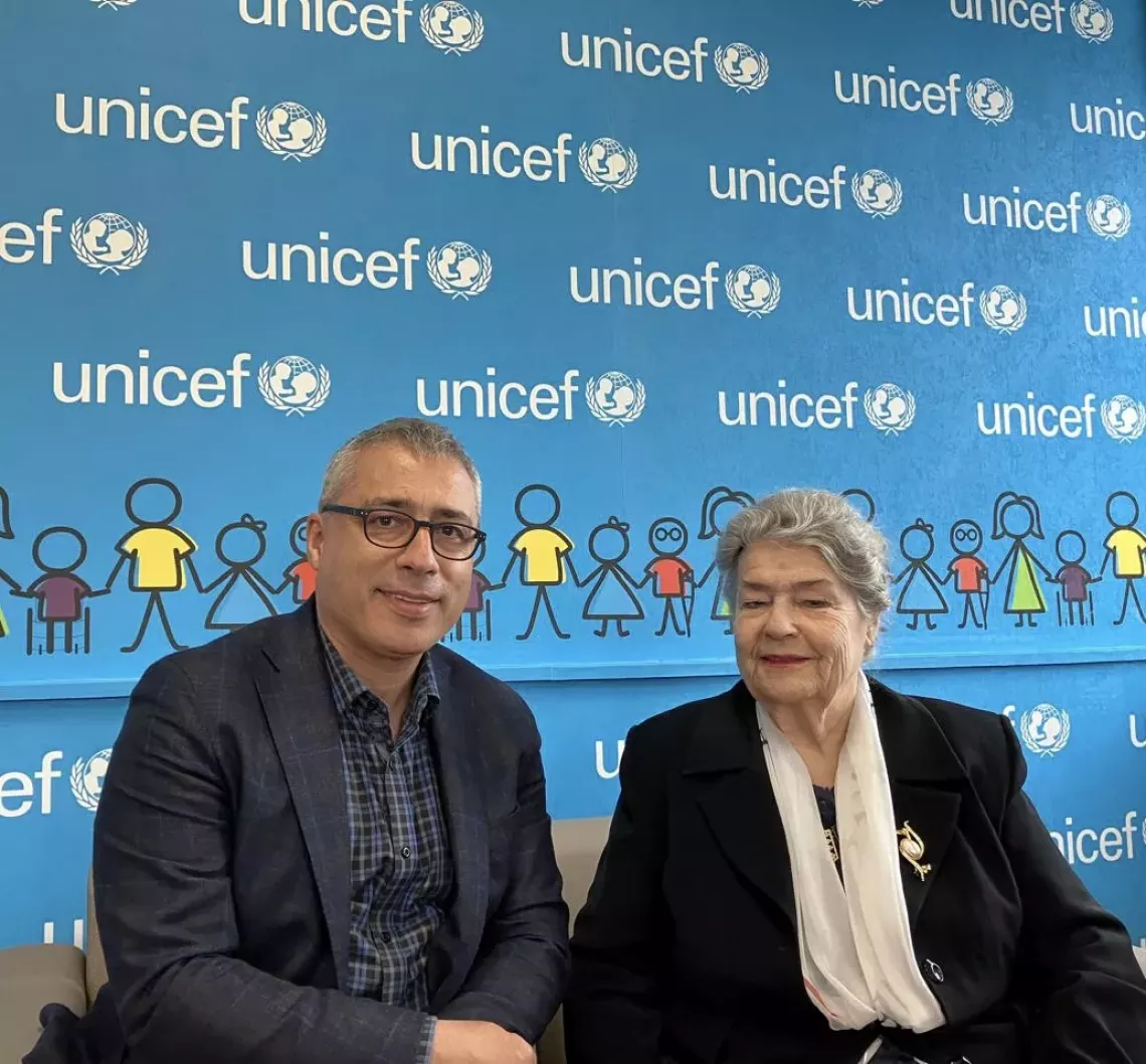 UNICEF representative posing with Margarita Xhepa