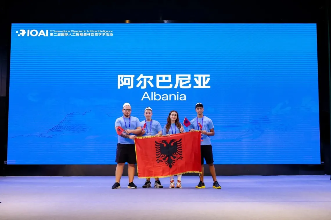 young students representing Albania posing with Albanian Flag