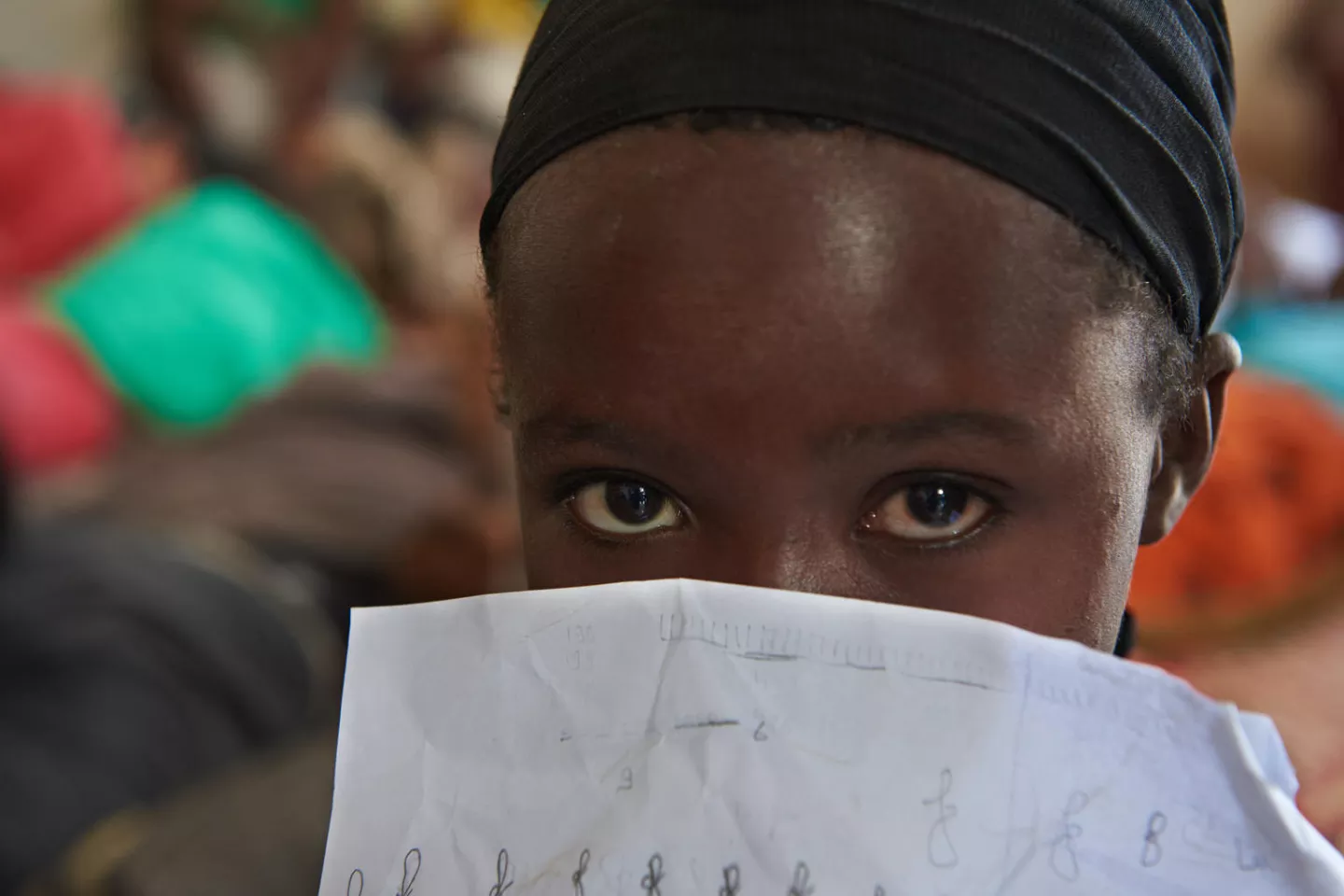 Feda [NAME CHANGED TO PROTECT IDENTITY], 6 years old, sits with other children in entertainment room at Caritas Centre for Children in the city of Djibouti. Djibouti