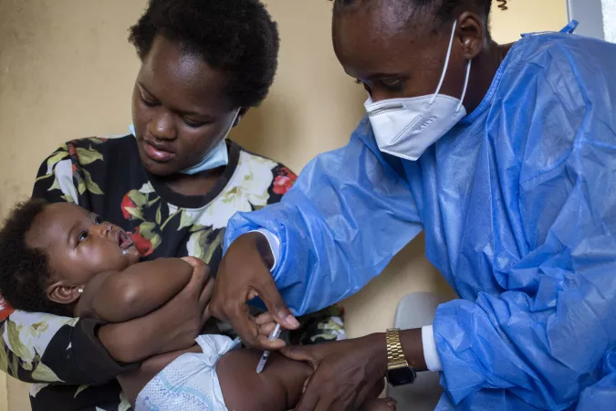 Catambor Health Centre in Luanda, Angola, 2-month-old Rakia is held by her mother, Delma Deoma, while Nurse Qu&eacute;nia Pinto administers the pentavalent vaccine.
