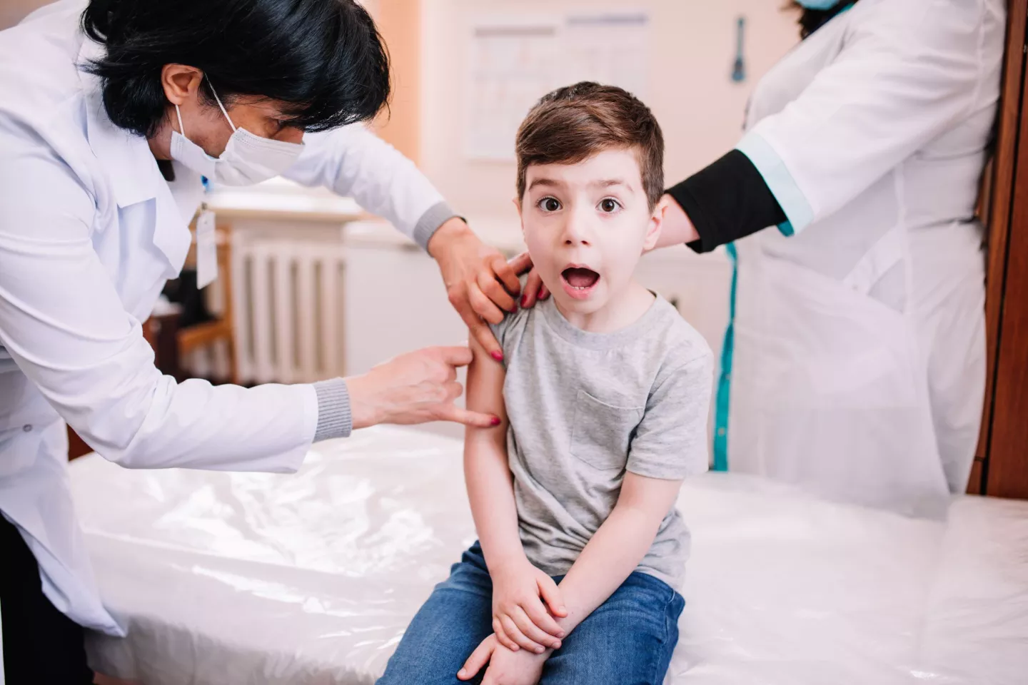 A 6-year old boy during routine vaccination