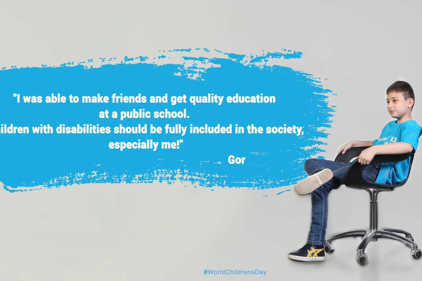 Gor in UNICEF cyan t-shirt is sitting with confidence on the office chair and his quote is written in cyan cloud on the left.