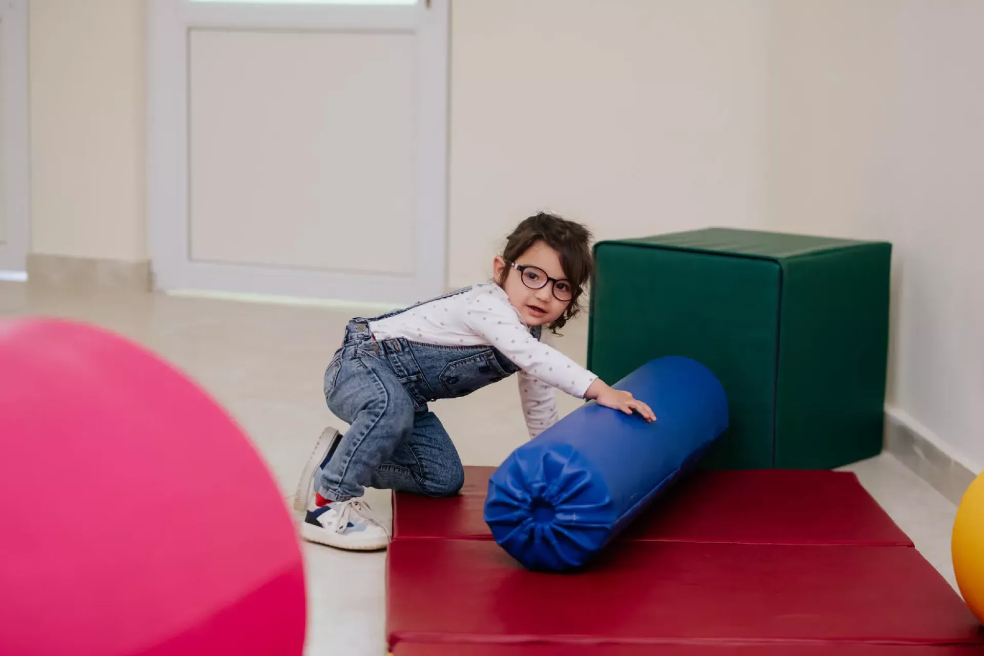 A little girl playing in a newly opened Vanadzor Special Equipment Library.