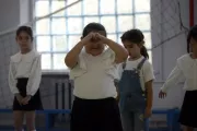 Arpi and her classmates are doing physical exercises in the school.