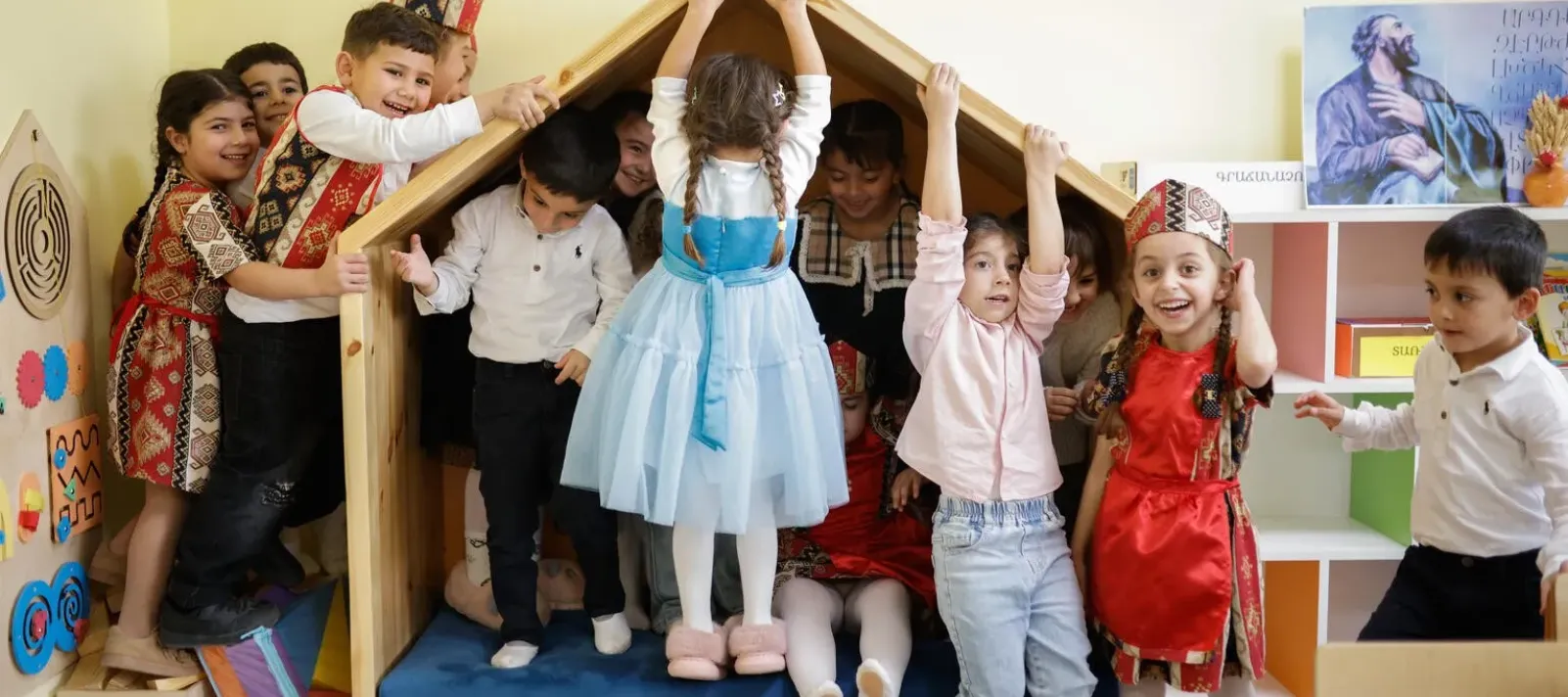Children are playing in the new classroom established by UNICEF. 