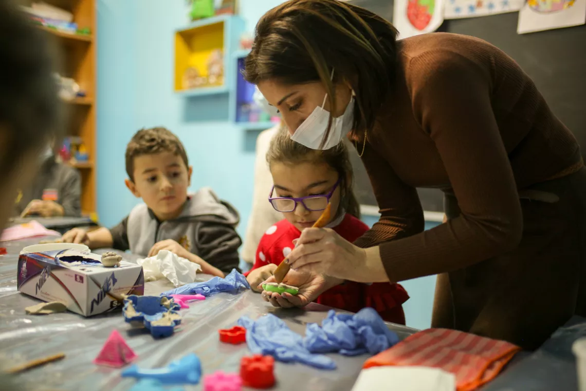 Marina is working with a child. 